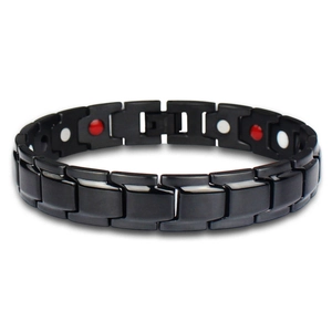 Men's black titanium steel magnetic therapy bracelet with matte finish in oval layout