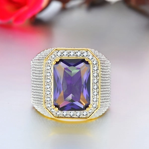 Macro shot of men's square purple zircon ring with gold plating and paved crystals