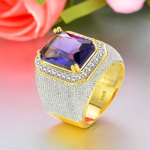 Detailed close-up of S925 sterling silver stamp on golden ring with purple stone