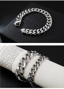 Polished silver Cuban link bracelet with a secure oversized lobster clasp detail