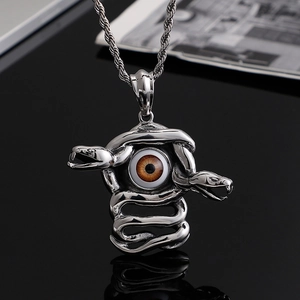 Punk style stainless steel necklace featuring a snake coiled around a brown evil eye pendant