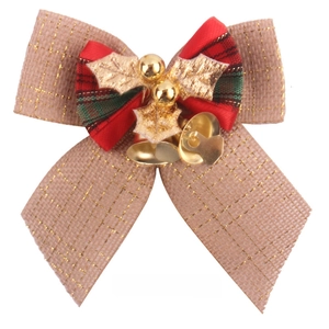 Linen and plaid Christmas bow with golden leaves and bells for holiday tree decoration