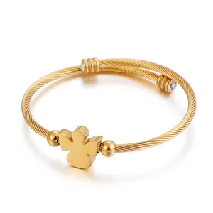 Gold angel-shaped titanium steel wire cuff bracelet with zircon accents on white background