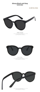 Multiple views of kids cat-eye sunglasses in shiny black frame and grey UV lenses