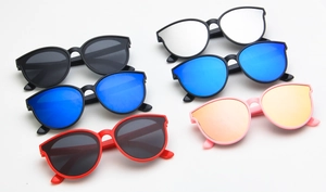 Detailed view of colorful round cat-eye kids sunglasses in various frame colors