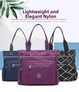 Three nylon tote bags in purple, blue, and plaid with metal zippers and round logos