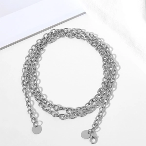 Detail of silver multi-layer chain with round pendant and lobster clasp closure