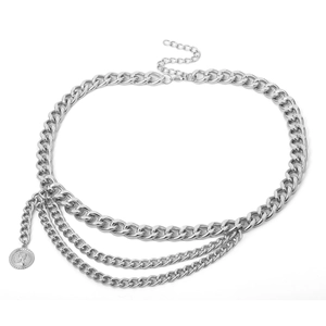 Detail of silver multilayer waist chain featuring coin pendant and lobster clasp