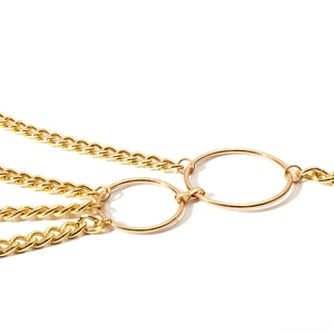 Detailed macro view of multi-layer gold metal waist chains with round ring fasteners