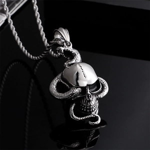 Punk style silver stainless steel pendant featuring a snake coiled around a skull