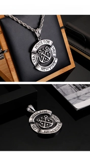 Macro detail of vintage steel anchor pendant with Houston and New York engravings