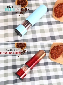 Close-up of electric grinders showing blue and gradient red finishes with salt and pepper