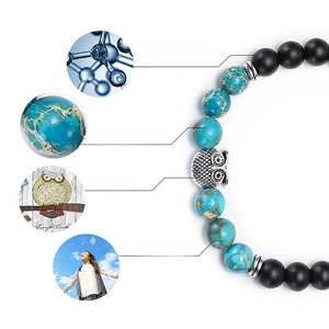 Matte black stone and blue emperor stone bracelet with central metal owl bead
