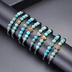 Beaded bracelets featuring turquoise and matte black stones with animal head charms