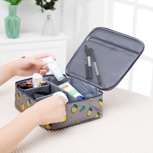 Internal view of grey lemon makeup bag showing multiple compartments and mesh pockets