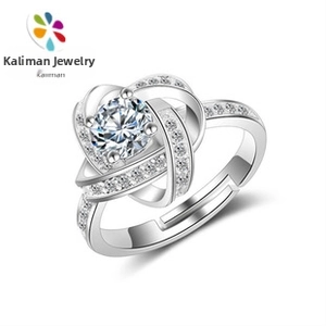Close-up view of an elegant silver adjustable ring featuring a brilliant round center stone.