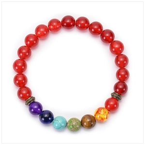 Detailed close-up of 8mm red natural stone chakra beaded bracelet on white background