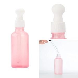 Pink glass perfume dropper bottle with white rubber top for essential oils and beauty products