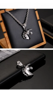 Detailed close-up of a silver unicorn pendant with a twisted rope chain in stainless steel