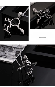 Macro detail of gothic stainless steel bird skeleton pendant showing intricate bone texture