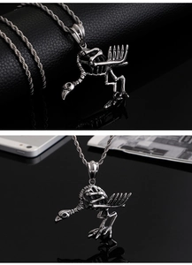 Detail view of silver punk crow skeleton necklace with intricate bird skull pendant