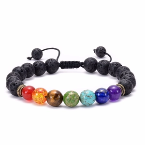 Adjustable chakra bracelet featuring volcanic lava beads and seven colored natural stones