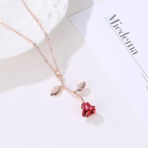 Elegant rose pendant necklace with red flower and rose gold chain for romantic gifting