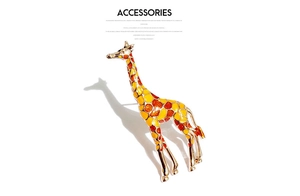 Detailed macro view of an elegant golden giraffe brooch with colorful enamel spots