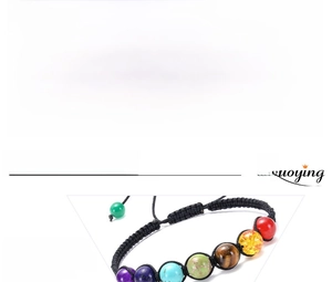 Macro detail of handmade 7 chakras energy bracelet with 8mm natural stones and braided cord