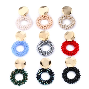 Set of 9 colorful beaded hoop earrings with gold metal studs in various vibrant colors