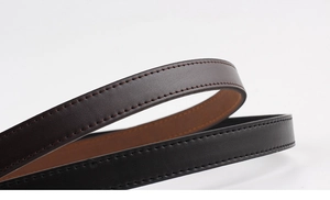 Detailed close-up of premium leather belts in black and brown with fine stitching