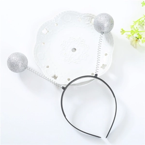 Sparkly silver glitter ball headband for Valentines day with bouncy metal springs on black base