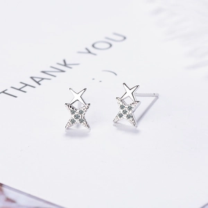 Silver four-pointed star stud earrings with pave zircon and elegant double star design