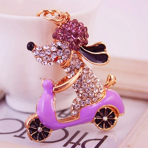 Rhinestone poodle on a purple scooter keychain accessory with gold-plated finish