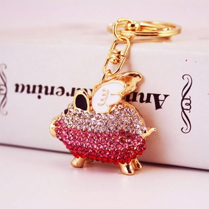 Portachiavi maialino volante dorato creativo con strass rosa e trasparenti