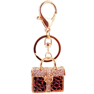 Sparkling rhinestone leopard print handbag keychain with gold metal finish and crystals