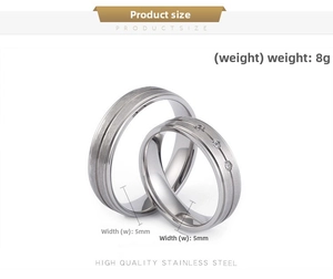 Detail view of 5mm brushed stainless steel rings featuring one band with three small zircons