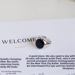 Detailed macro shot of S925 sterling silver ring featuring a black oval resin inlay