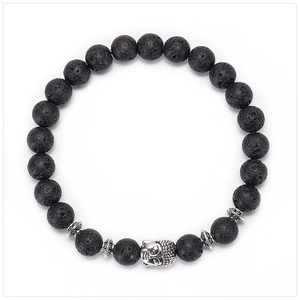 Close-up of black lava stone beads and silver Buddha head on a handmade beaded bracelet