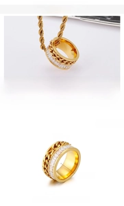 Detail view of a 11mm wide golden chain ring featuring zircon inlay and stainless steel