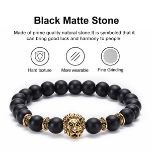 8mm black matte stone beaded bracelet with golden lion head charm and natural textures