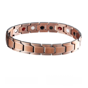 Detail of rose gold magnetic therapy bracelet featuring brushed metal and inset energy stones