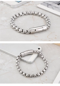 Detailed macro view of silver titanium steel men's chain with cylindrical buckle