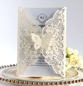 Detailed laser-cut wedding invitation with butterfly buckle and purple inner card