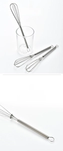 Detail of stainless steel mini whisk with spring handle and integrated hanging loop