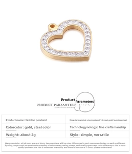 Detail showing paved zircon heart pendant in gold and steel finish with 18K plating