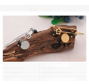 Detail of MOM love you bracelets in gold and steel finish with flower charms