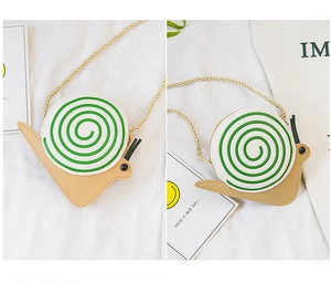 Detail of snail-shaped crossbody bag with khaki body and green spiral shell detail