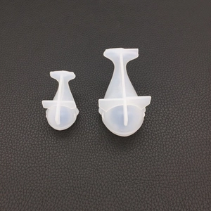 Detail view of two translucent silicone resin molds in droplet shapes for DIY jewelry making