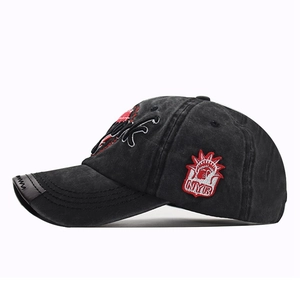 Detail of NYR lettering and Statue of Liberty embroidery on black washed cotton cap